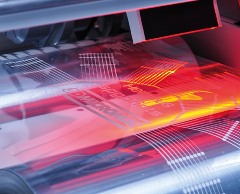 Roll-to-roll laser machining for forceless and contactless processing with highest precision